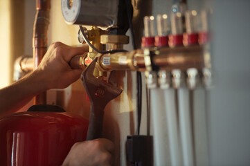 Plumber installing water floor heating system