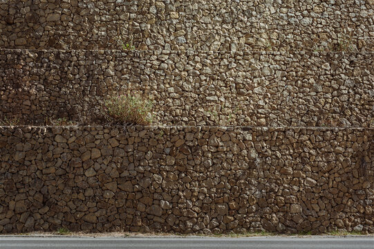 Stone wall and grass background