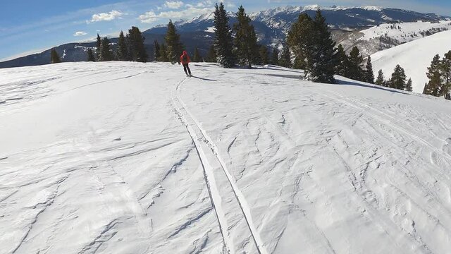 Follow Cam Of A Solo Woman Skiing On A Sunny Winter Day