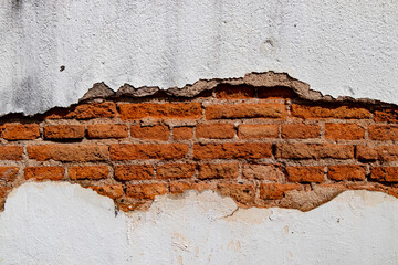 Old white concrete wall with crack and inside is brown concrete for background