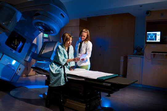 Medical Radiation Therapy Cancer Treatment at Hospital - Therapist Helping Patient