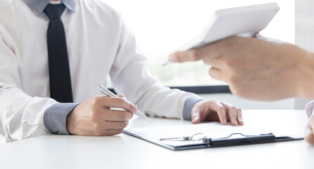 Real estate agent or sales manager has offered home sales and explained the terms of signing the house purchase contract and free home insurance, Finance and after-sales service concept.