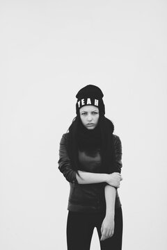 young woman wearing hat with text yeah