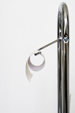 last piece of toiletpaper on a roll, minimalist composition