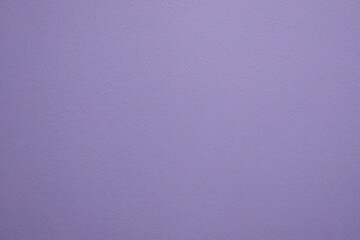 The texture of the wall plaster is lilac. Abstract background of a pleasant lilac color.