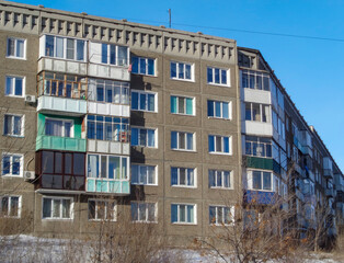 Soviet apartment building. Apartment block. Old residential area. Winter cityscape. Blue sky. Winter. January 2021. Ust-Kamenogorsk (kazakhstan)