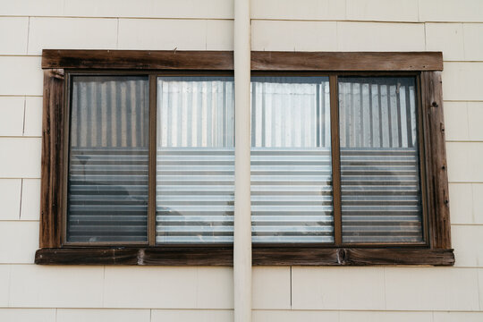 window covered with corrugated metal
