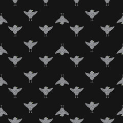 Fototapeta na wymiar Dark seamless pattern with grey flying birds shapes ornament. Brown background.