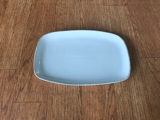 empty white plate one of eating utensils 