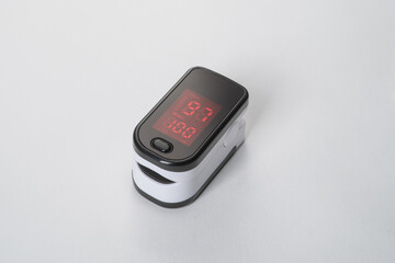 Portable digital fingertip oximeter isolated on white background