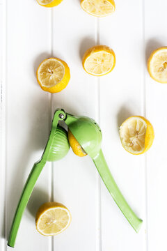 squeezed lemons with green juicer