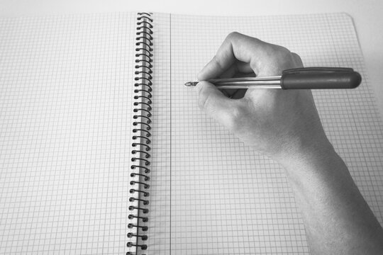 Hand writing on a notepad