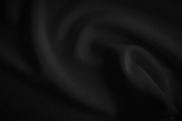 Black wavy cloth. Dark tone  fabric background