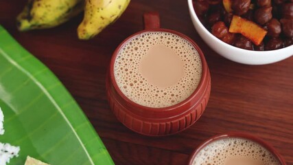 Indian milk tea Chai traditional beverage morning tea for breakfast made with milk spices Kerala India Sri Lanka 4K slow motion video footage. organic green tea ayurvedic herbal drink.