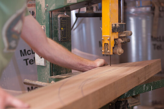 Close-up detail of a carpenter using a power saw