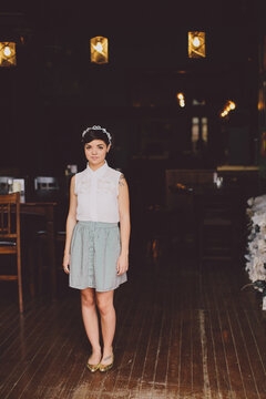 Girl in a skit in the doorway of a restaurant