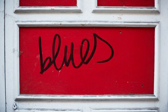 Blues word on a red door