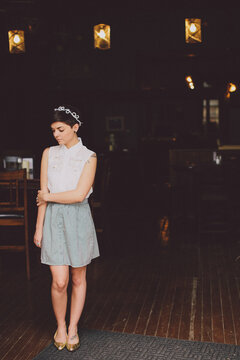 Girl in a skit in the doorway of a restaurant