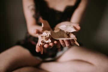 woman showing wrinkled book pages