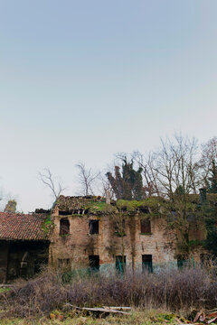 Antique farm ruins in wintry landscape in northern Italy