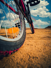 bicycle wheel in the desert