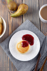 Delicious lush homemade cheesecakes on a wooden table