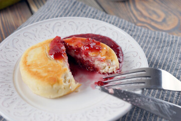 Delicious lush homemade cheesecakes on a wooden table