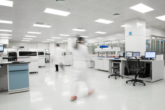 BLurred motion of scientists walking in a lab