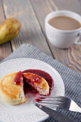Delicious lush homemade cheesecakes on a wooden table