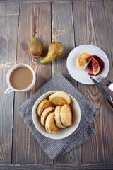Delicious lush homemade cheesecakes on a wooden table