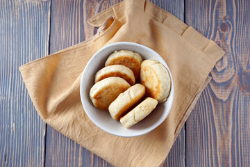 Delicious lush homemade cheesecakes on a wooden table
