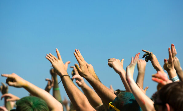 Cheering hands in the air at a concert