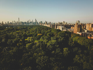 New York Central park is a gem of a location. This photos was taken in the early morning just above the tree line to show the vast forest of new york central park contrasting against the surroundings