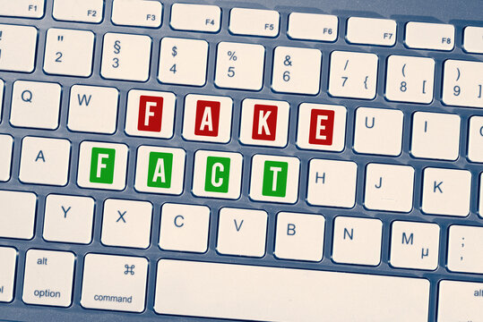 Computer And Keys For Fake And Fact	