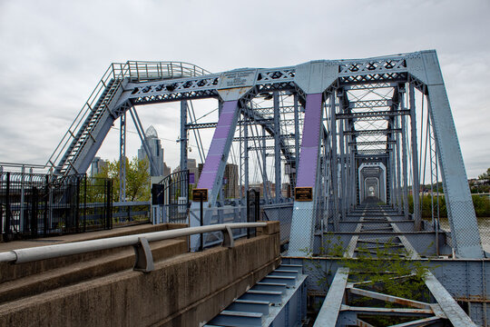 The Newport Southbank bridge was the first railroad bridge spanning the Ohio River. Now it's know it's a pedestrian only bridge known as the Purple People Bridge.  Newport, KY USA.