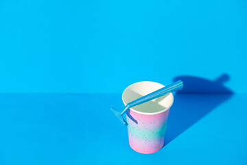 Female disposable razor in a cup, studio shot
