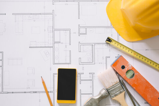 construction concept with blueprints