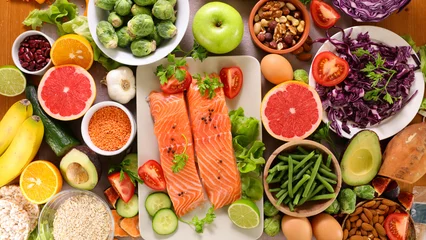 Fotobehang health food selection- salmon, avocado, fruit, nuts © M.studio