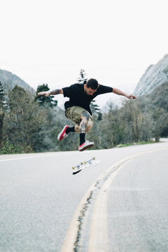 Skateboarder 360 Flip Canyon Road