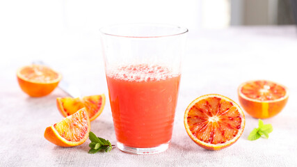 red orange juice in glass