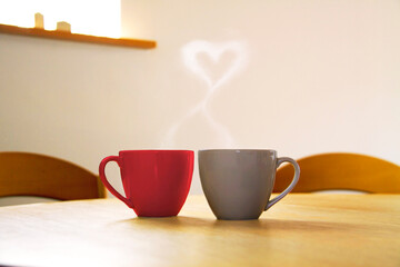 ２つのコーヒーカップとハートの湯気