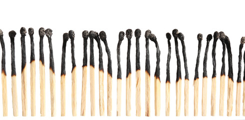 Burnt out matches on white background