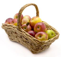 ripe red apples in basket isolated on white background