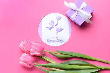 Composition with beautiful flowers and greeting card for Mother's Day on color background