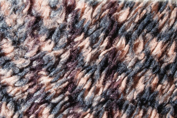 Close-up fabric texture. Fabric background. Fancy curls of colored fabric fibers. Increased tissue structure.