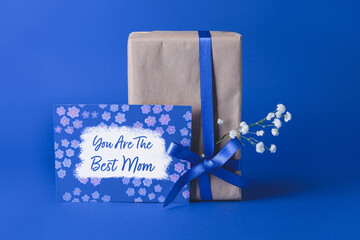Gift and greeting card for Mother's Day on color background
