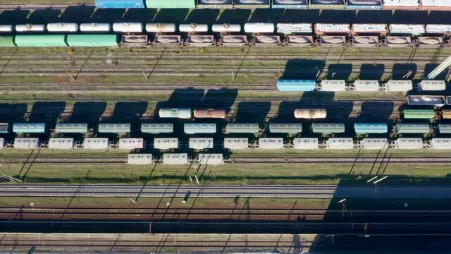 Trains from above. Aerial Top view to railway cylindrical tank shipping containers Rail way . Striped creative transport industry representation. railroads and freight trains to transport cargo Video