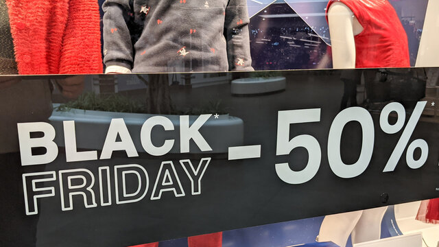 black friday banner -50% sign on windows store of commercial shop