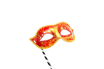 Red mask party or carnival Venetian mask with handle isolated on white background	