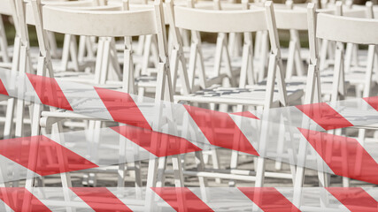 Seminar room with empty chairs and barrier tape due to coronavirus lockdown